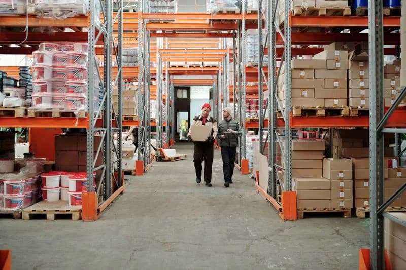 Warehouse staff moving stock through a distribution centre